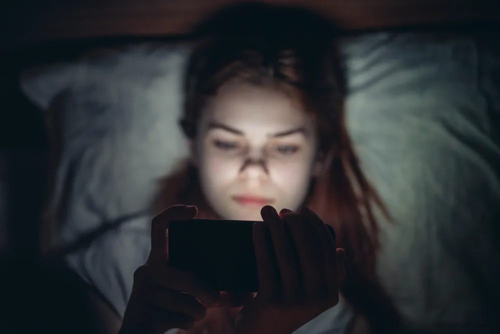 Woman looking at phone.