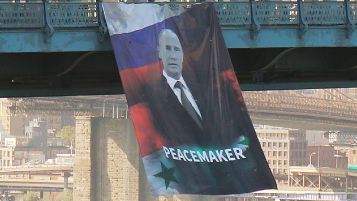 A giant Putin poster randomly showed up on New York's Manhattan Bridge |  Mashable