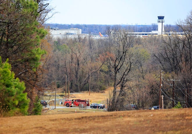 Emergency vehicles appear near the location where a small aircraft crashed while taking off from the Bill and Hillary Clinton National Airport in Little Rock, Arkansas on Wednesday.