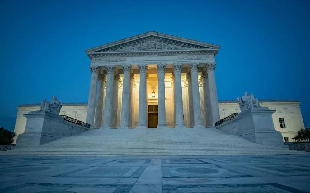 United States Supreme Court Building with columns and steps

Description automatically generated