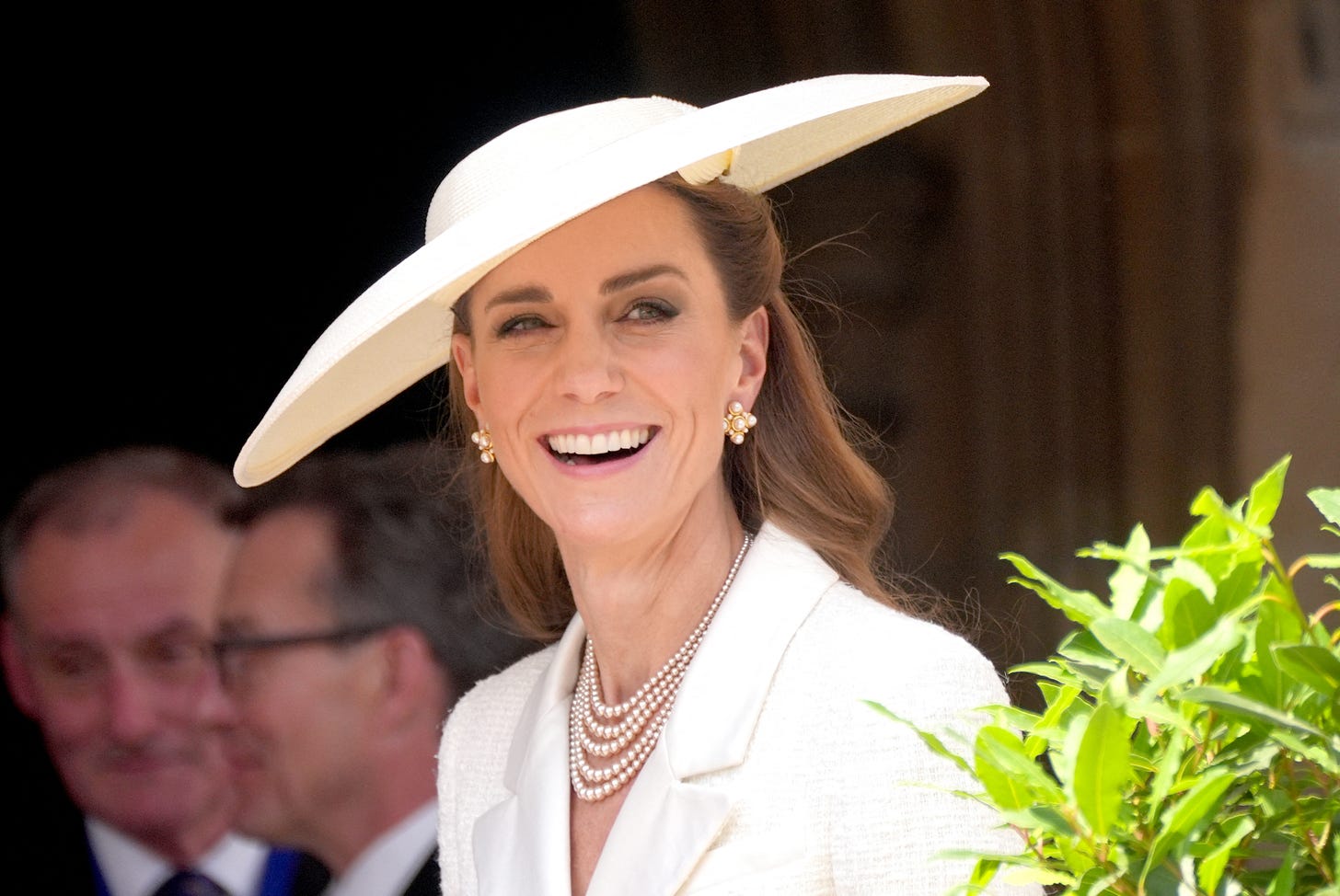 Smiling Princess Kate in white jacket and hat