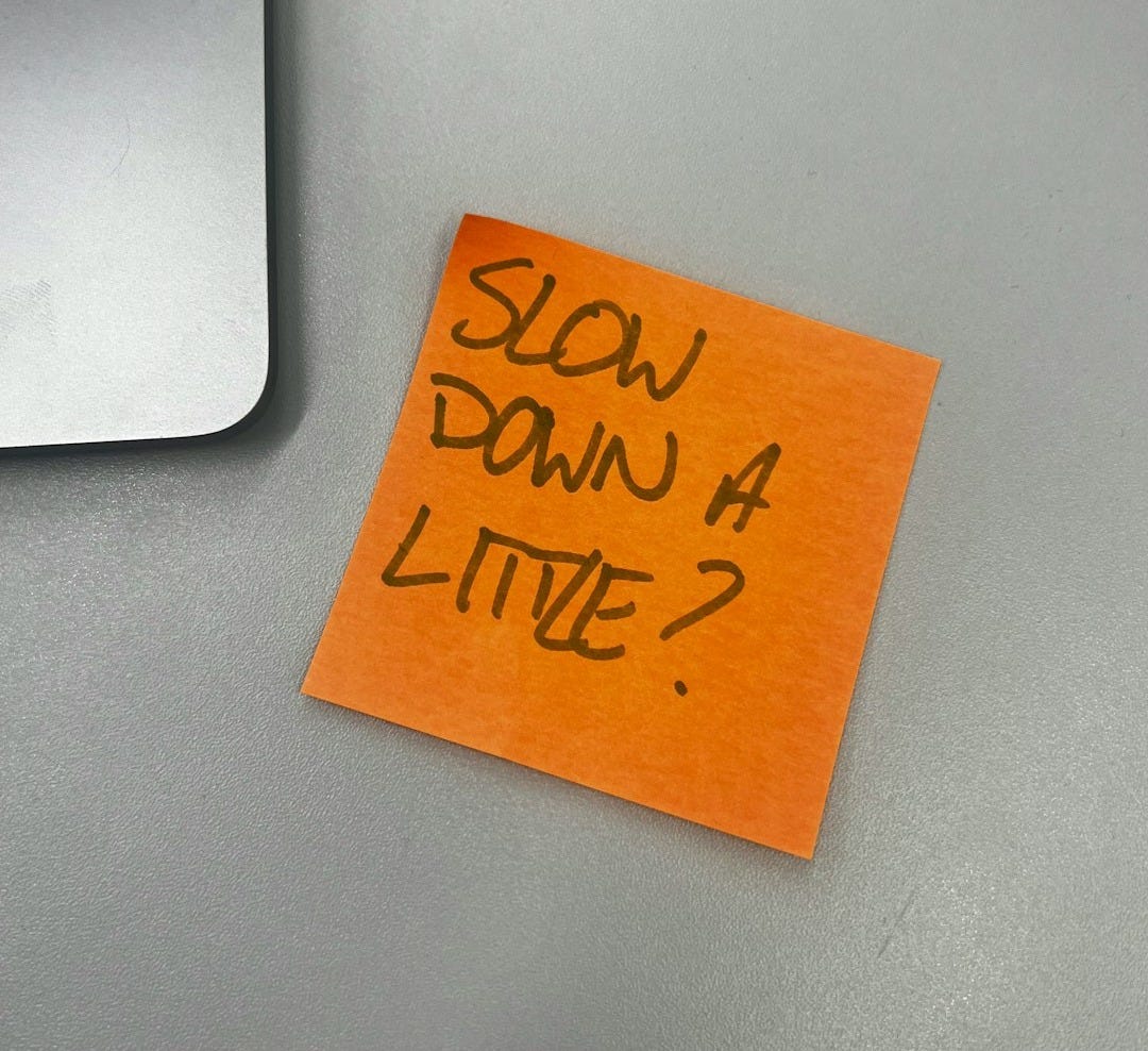 a piece of orange paper with the words slow down 4 little written on it