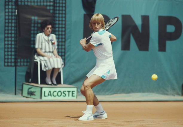 Martina Navratilova of the United States makes a backhand return against Chris Evert during their Women's Singles Final match at the French Open...