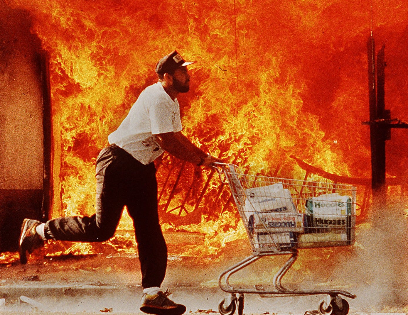 Man Running through Flames during LA Rodney King Riots 1992