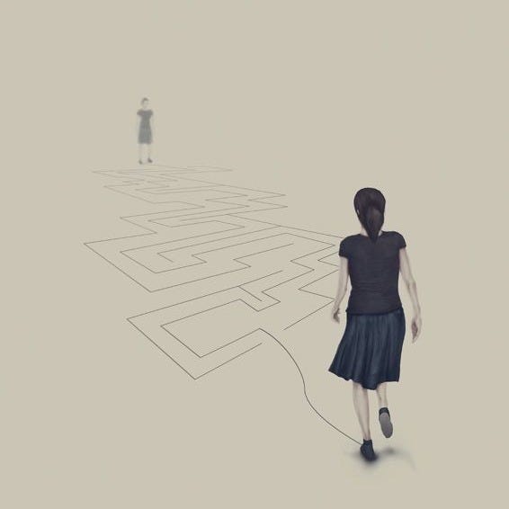 This may contain: a woman is walking in the middle of a maze