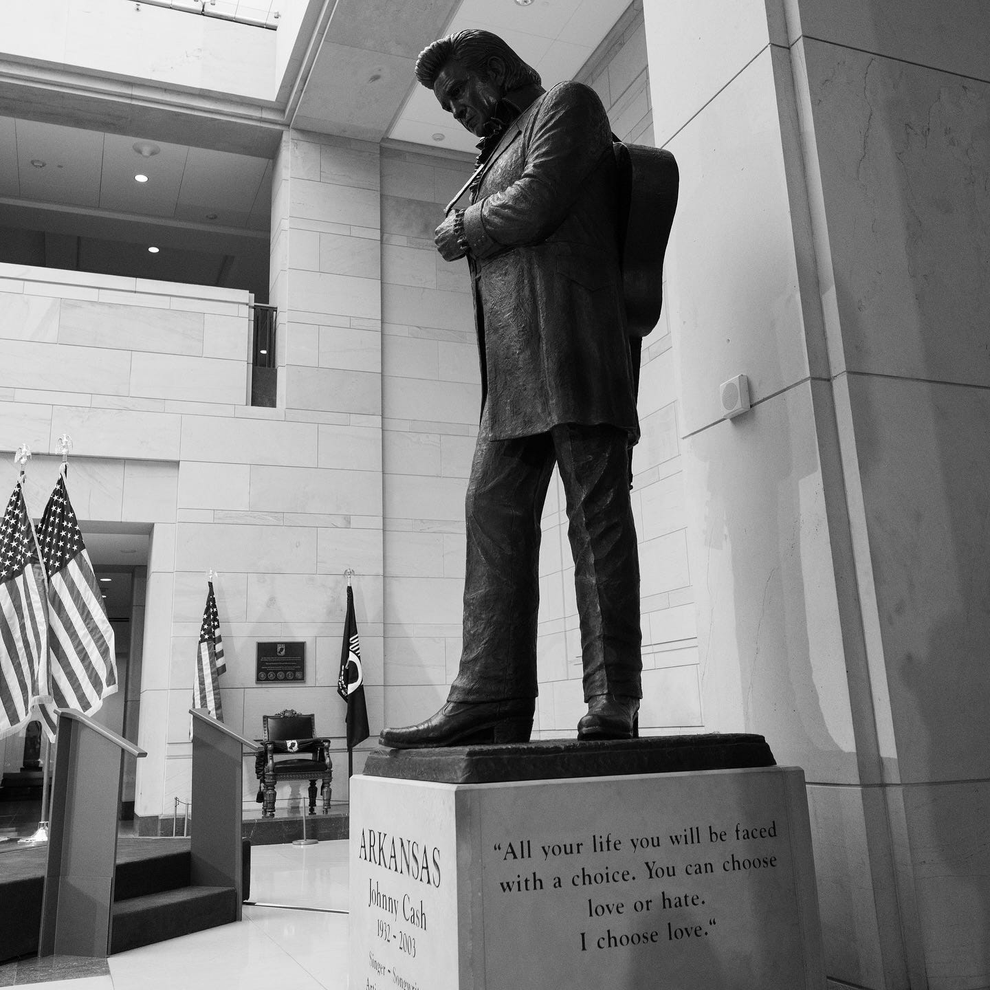 Photo shared by Senator John Boozman on September 24, 2024 tagging @johnnycash. May be a black-and-white image of sculpture, bust, statue, the Vietnam Veterans Memorial and text.