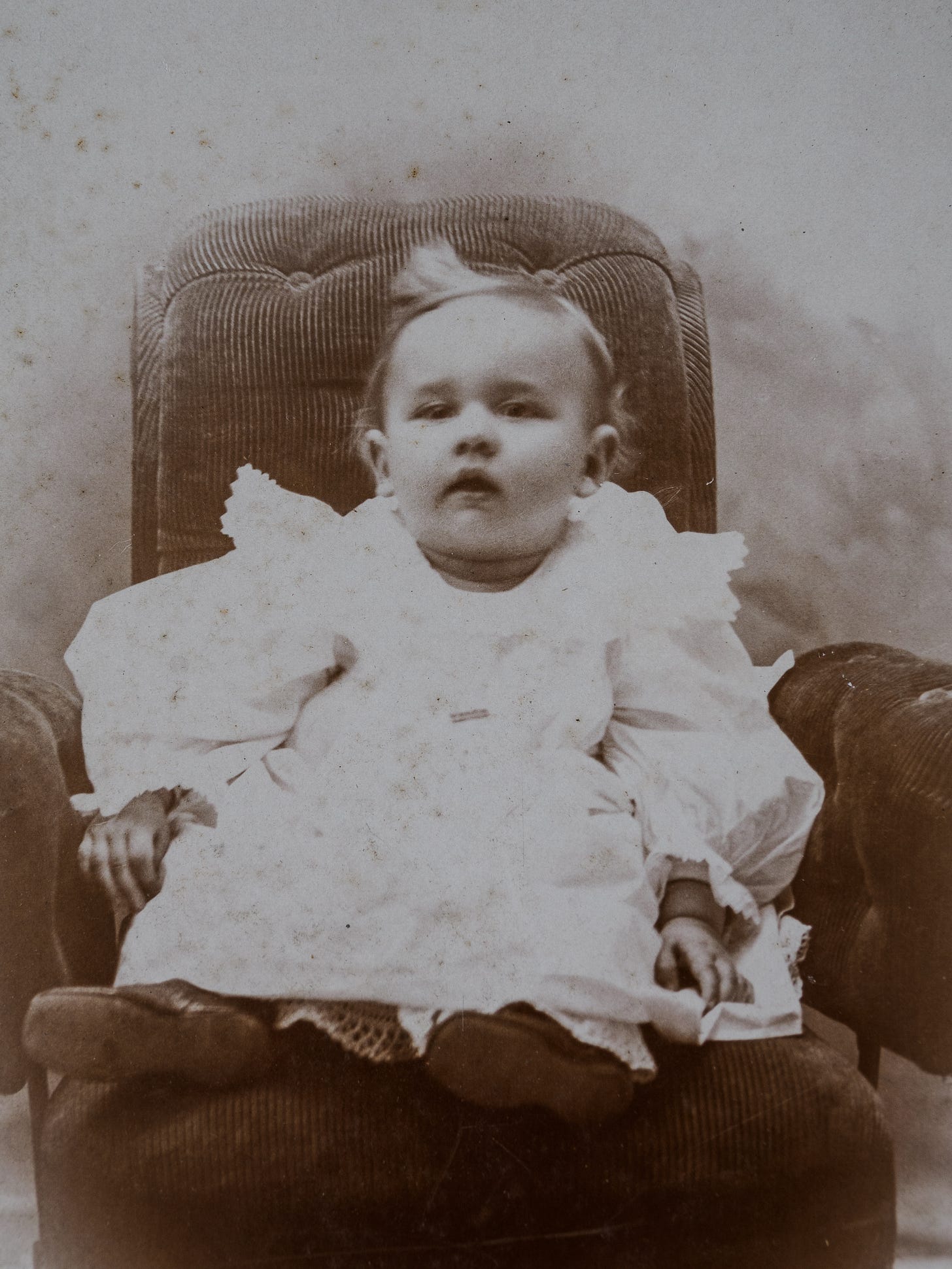 Young child in chair taken in late 1800s