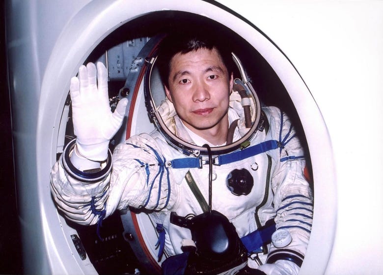 Taikonaut Yang Liwei boarding the Shenzhou-5 spacecraft before launch.