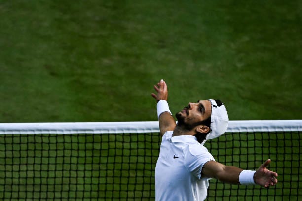 Italy's Lorenzo Musetti celebrates winning against US player Taylor Fritz during their men's singles quarter-finals tennis match on the tenth day of...