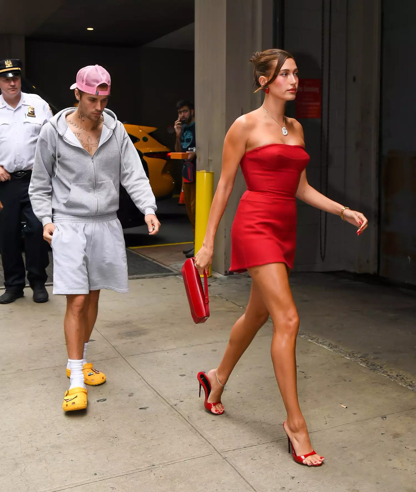 Justin Bieber in Sweats and Hailey Bieber in Red Minidress Rhode Strawberry Promotion New York August 2023