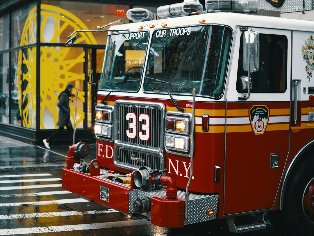 shallow focus photo of white and red firetruck