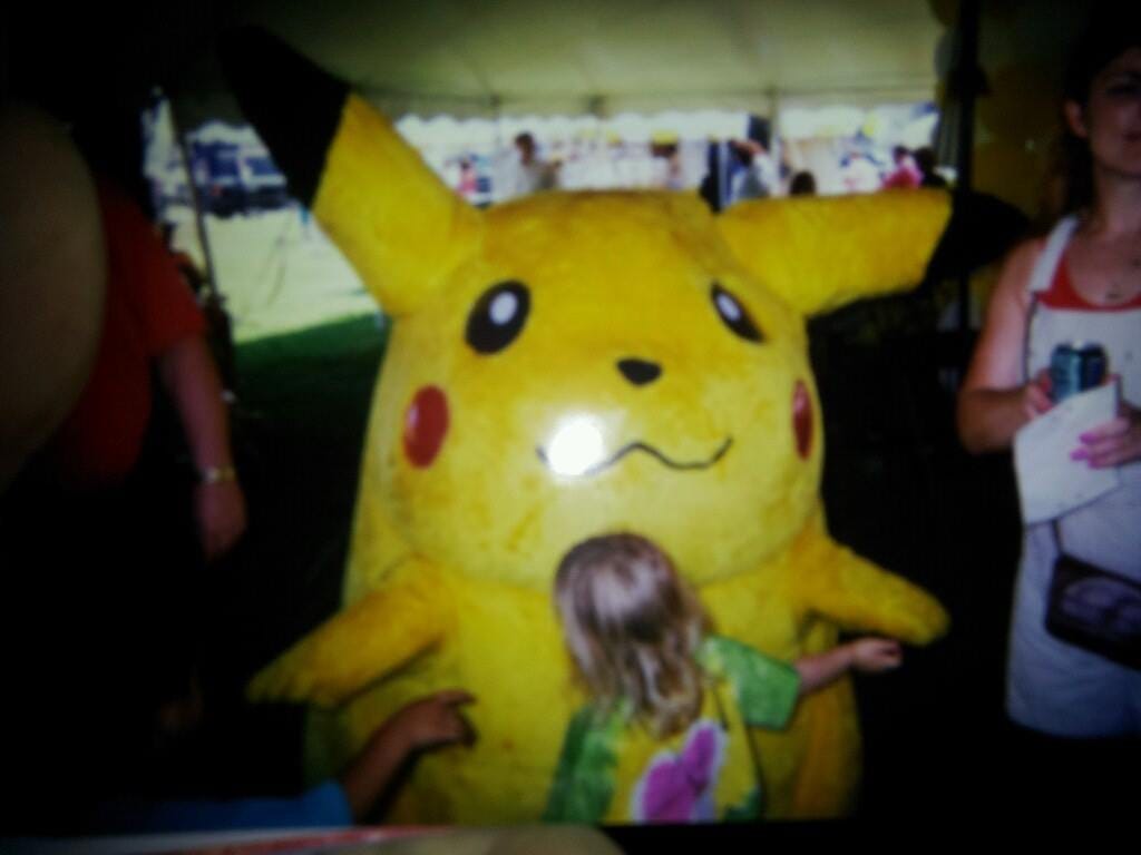 Pikachu seems more than happy to receive a hug from attendees! (Photo credit: Selena Ann Juarez)