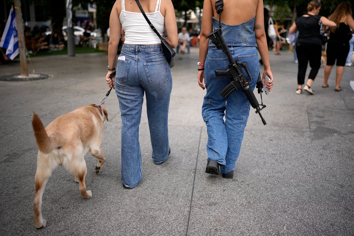 Guns slung around women's shoulders is becoming a common sighting