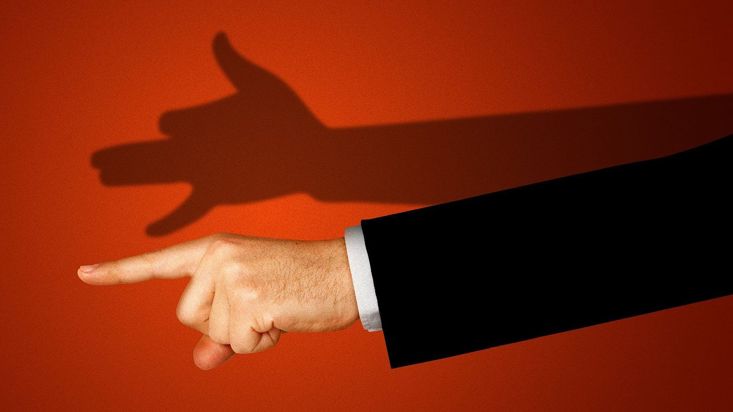 Illustration of a hand pointing accusingly, with the shadow of the hand in the shape of a barking dog. 