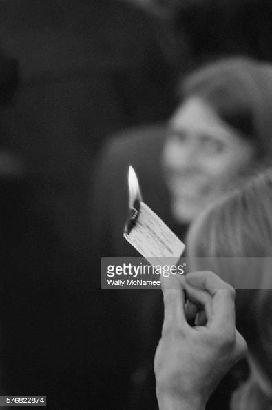 An anti-Vietnam War protester burns his military draft card during a ...