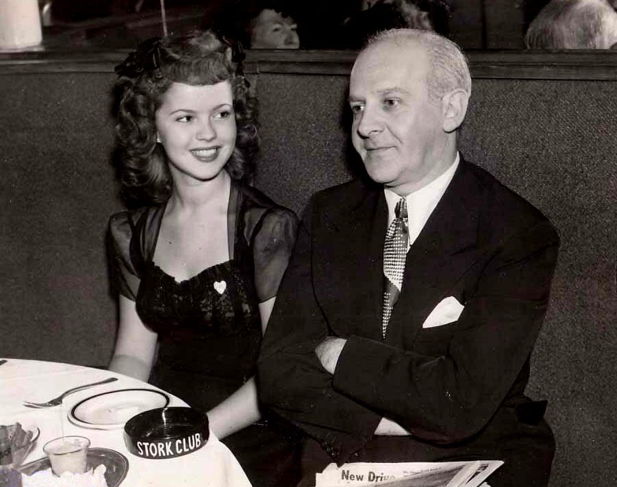 Shirley Temple and Walter Winchell at the Stork Club.