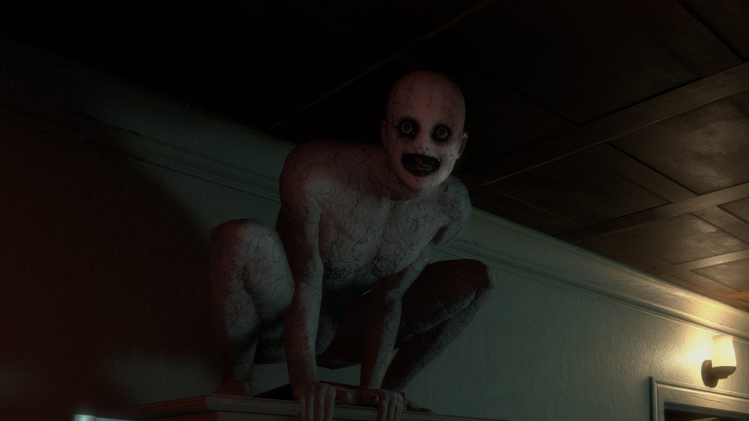 A screenshot of the white-faced goblin like creature that appears often in the game. In this case, perched in a squat atop of a cabinet. It stares at the viewer with a wide-eyed, toothless grin in an unnerving fashion