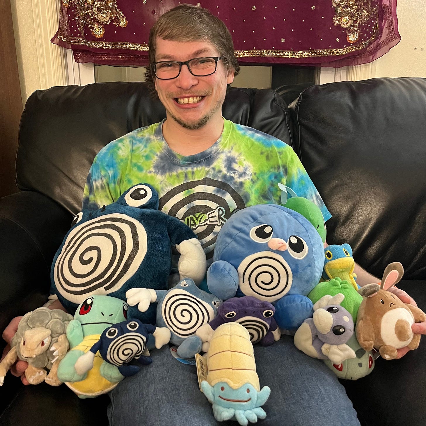A photograph of Slix with his Pokémon plush toys from April 2023