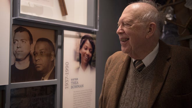 The Rev. Ed King smiles at a display at the Mississippi Museum of Civil Rights that pictures a young King standing next to Clifton Whitley, a candidate for the U.S. Senate.