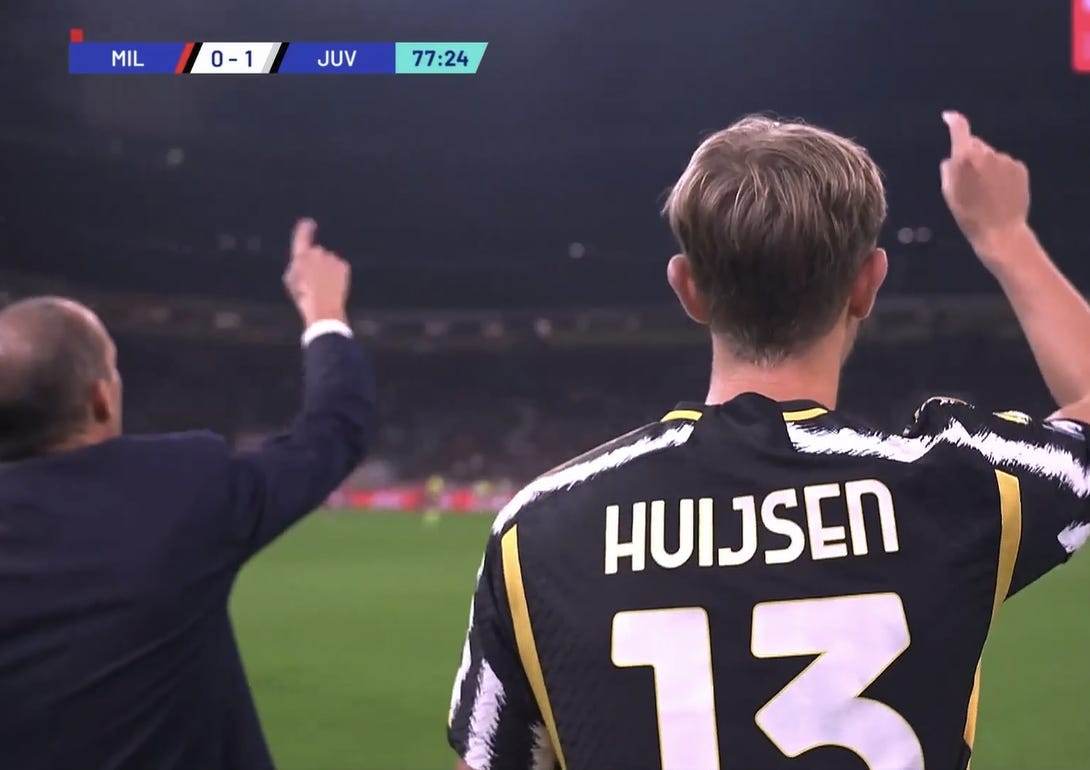 A screnshot of Dean Huijsen coming on to make his senior Juventus debut. He's pointing in sync with Max Allegri.