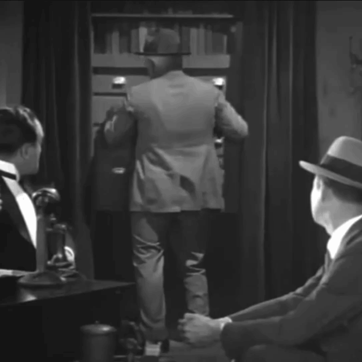 Animated gif - a cop finds the storeroom hidden behind a fake bookcase in the Hawk's office in 1928 film New York LIghts