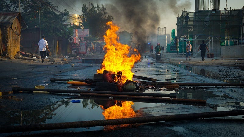 a fire in the street, evidence of a riot on the pavement