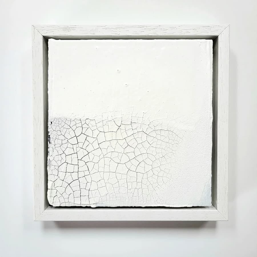 Modern white painting with cracked effect at the bottom