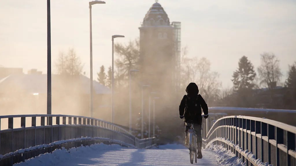 cyclist cycling in Oulu during the winter