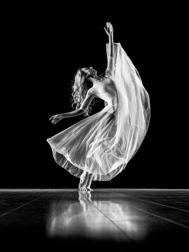 A ballerina dancing, a black and white photograph.