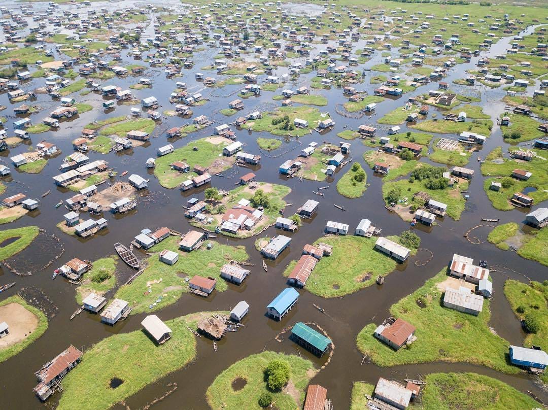 The floating village of Ganvie in Benin, which has houses on stilts or little islands in the middle of a lake