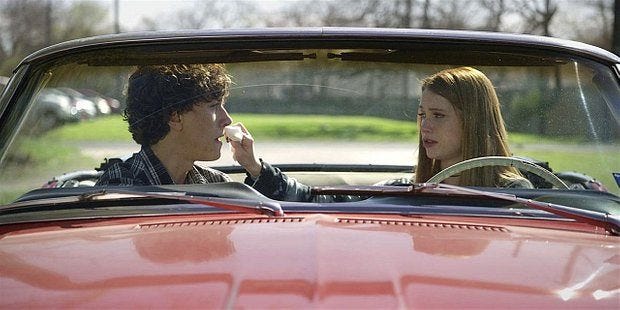 Walker Trevor and Stella in red convertible talking about heading out.