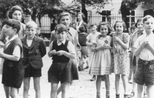 A photograph of Jewish children in the Theresienstadt ghetto taken during an inspection by the International Red Cross. [LCID: 73346b]