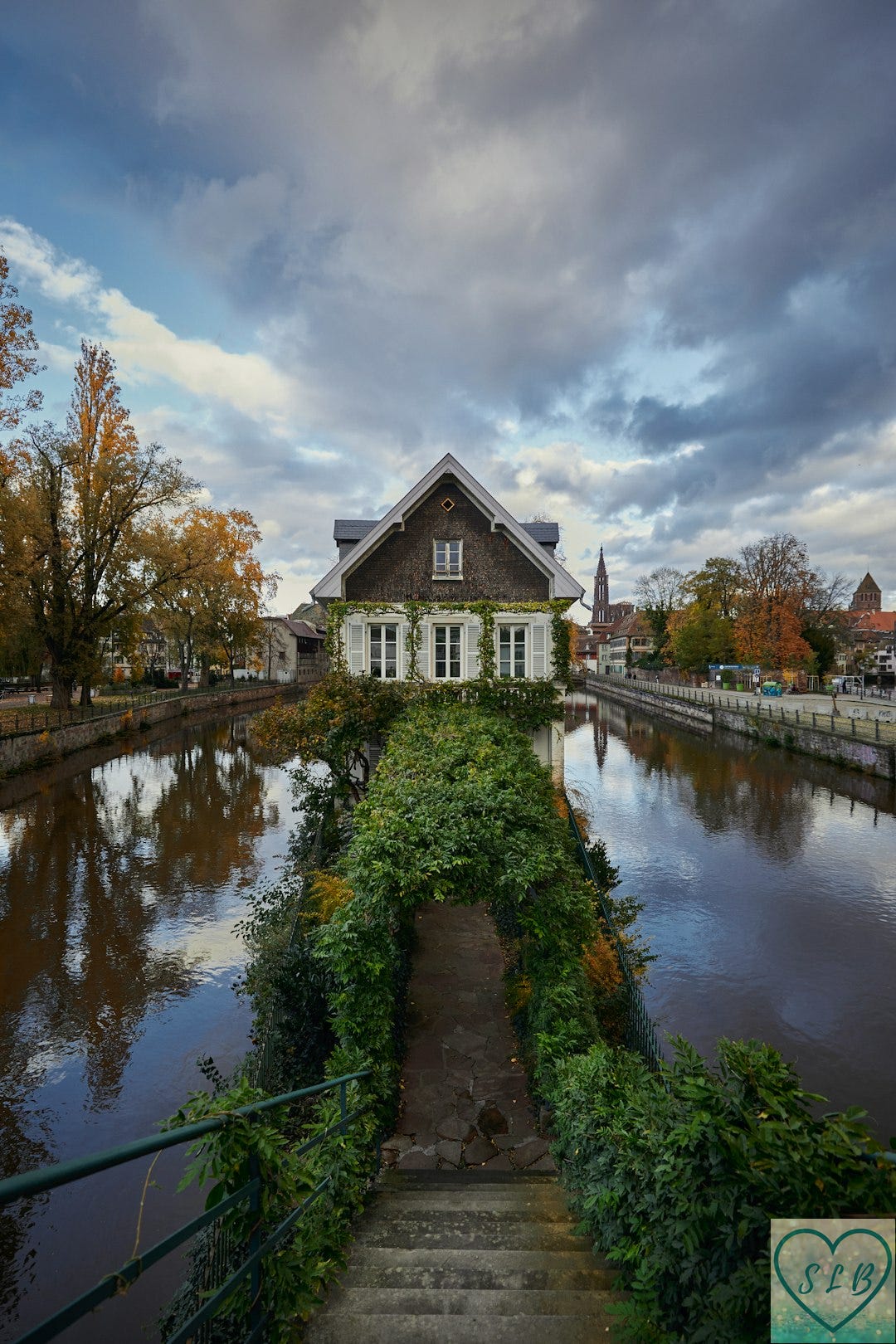 a house sitting on the side of a river