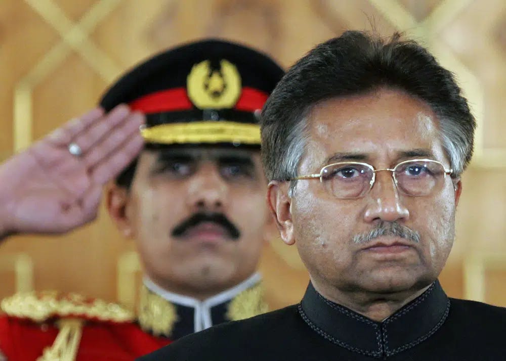 FILE - Pakistan's President Pervez Musharraf listens to the national anthem before being sworn in as the country's civilian president at President House in Islamabad, Pakistan on Nov. 29, 2007. An official said Sunday, Feb. 5, 2023, Gen. Pervez Musharraf, Pakistan military ruler who backed US war in Afghanistan after 9/11, has died. (AP Photo/B.K.Bangash, File)