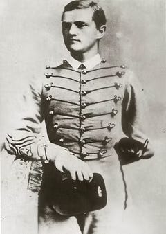 Formal photo in uniform of Cadet Pershing at West Point, 1886. Black and white.