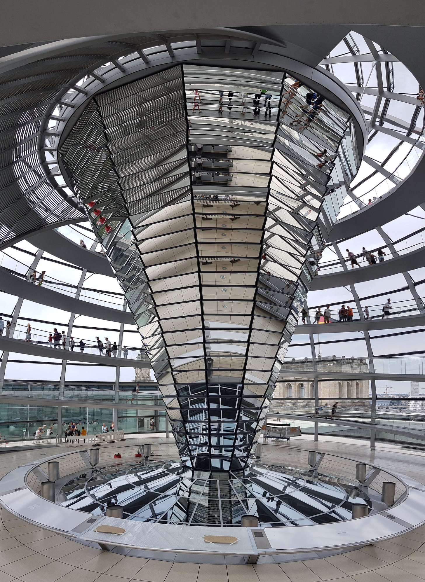 A giant mirrored central column inside a glass dome