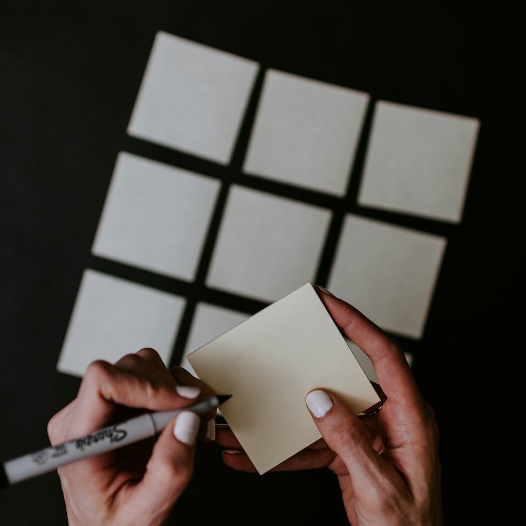 person holding white printer paper