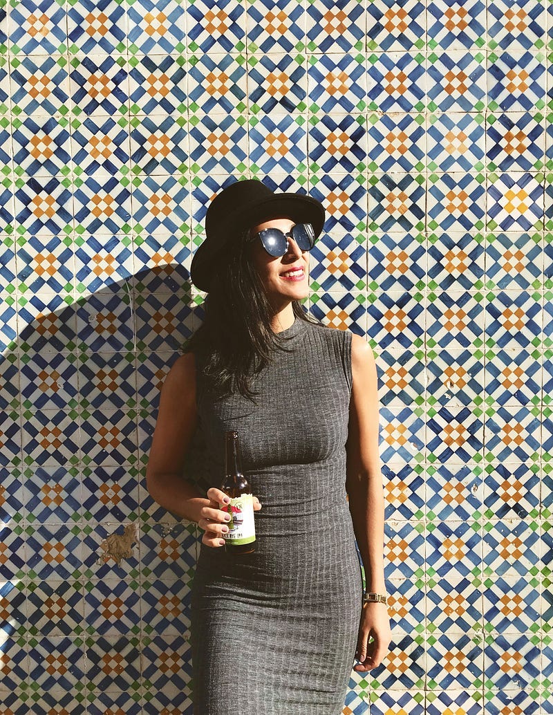 Woman looking at the sunshine, wearing a black hat and sunglasses Woman looking at the sunshine, wearing a black hat and sunglasses