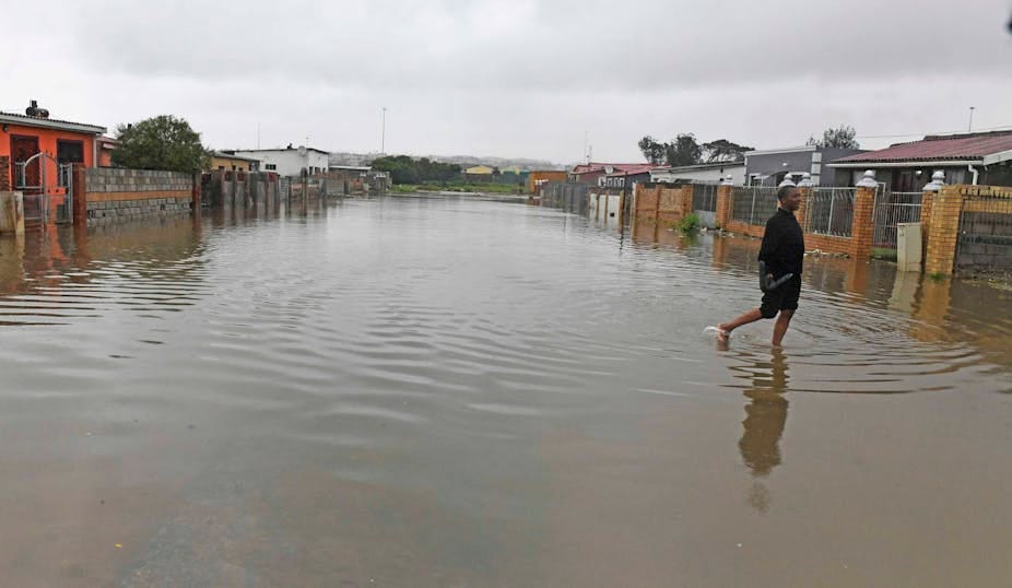 A street of ordinary houses that has been flooded A street of ordinary houses that has been flooded