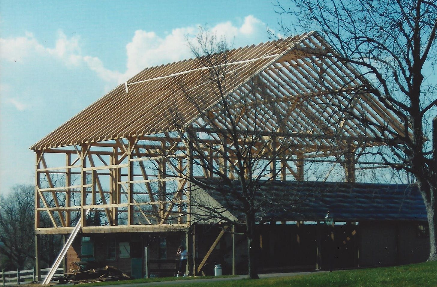 A barn is framed out and ready to rise from the ashes