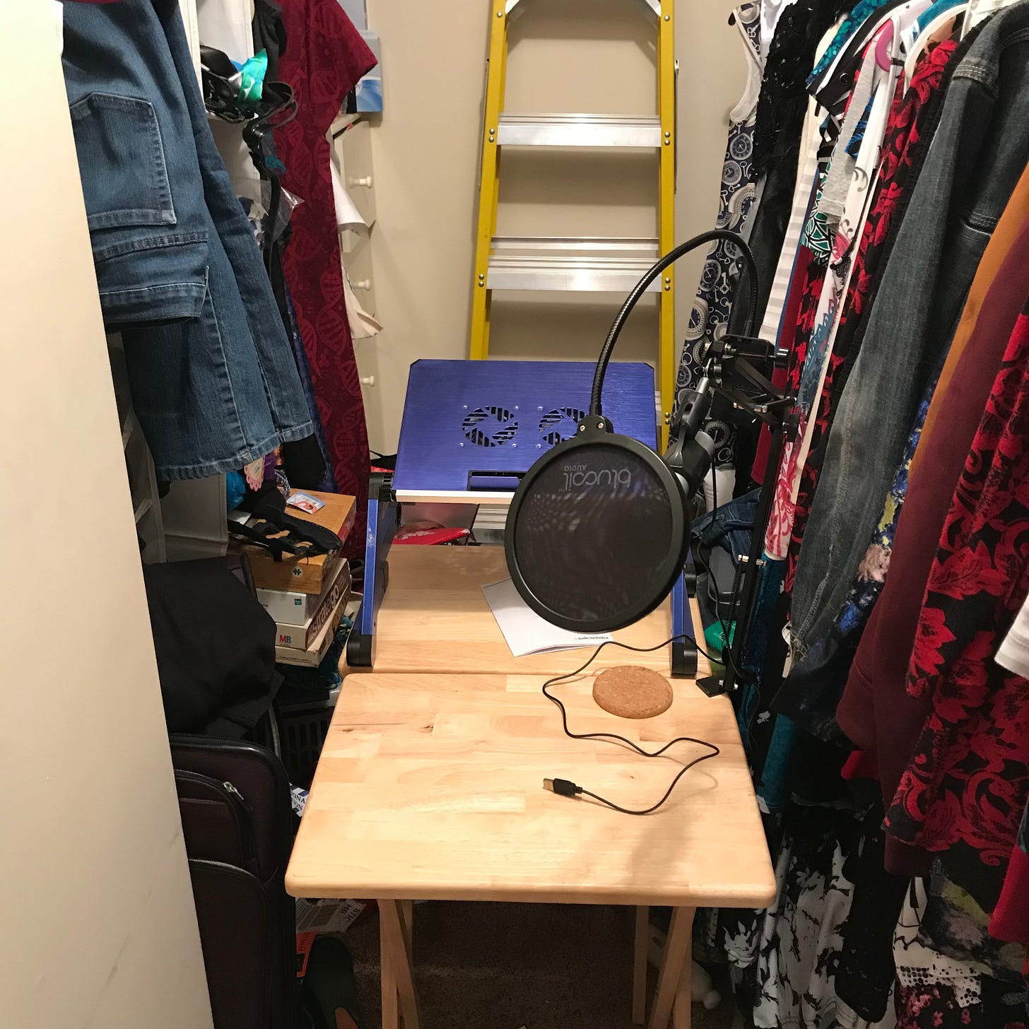 A makeshift podcast "studio" in a closet