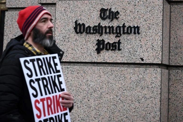 Employees of The Washington Post, joined by supporters, walk the picket line during a 24-hour strike outside of paper's headquarters (Brendan SMIALOWSKI)