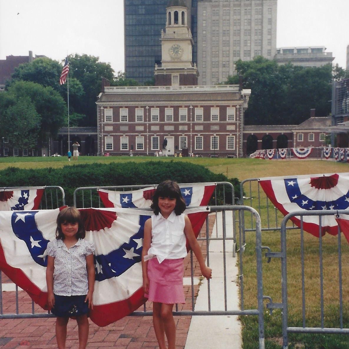 Two little girls standing in front of Independence Hall.