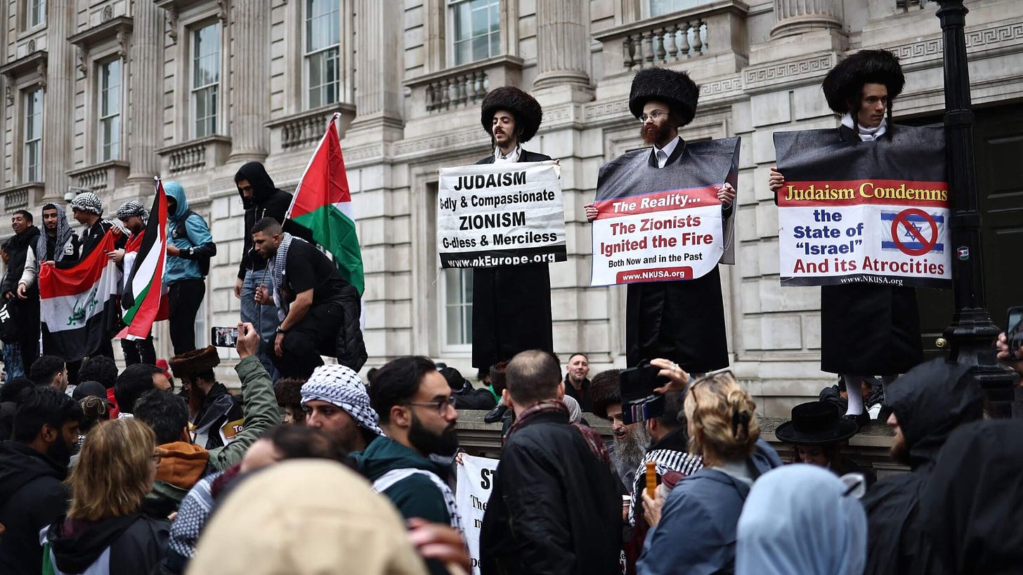 Members and supporters of Neturei Karta take part in a "March For Palestine" in London in October.