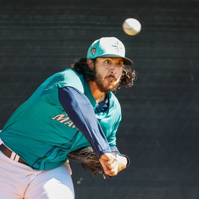 Andres Munoz throws a bullpen session Wednesday.  The Seattle Mariners held Spring Training Wednesday, Feb. 21, at the Peoria Sports Complex, in Peoria, AZ. (Dean Rutz / The Seattle Times)
