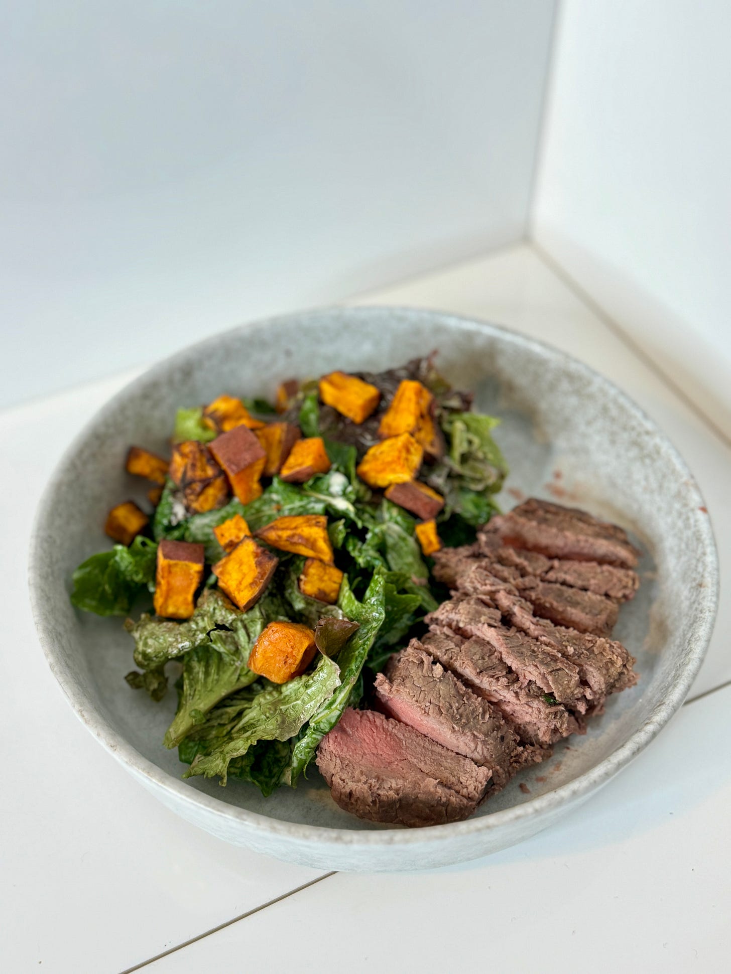 Creamy Caesar salad with grilled steak