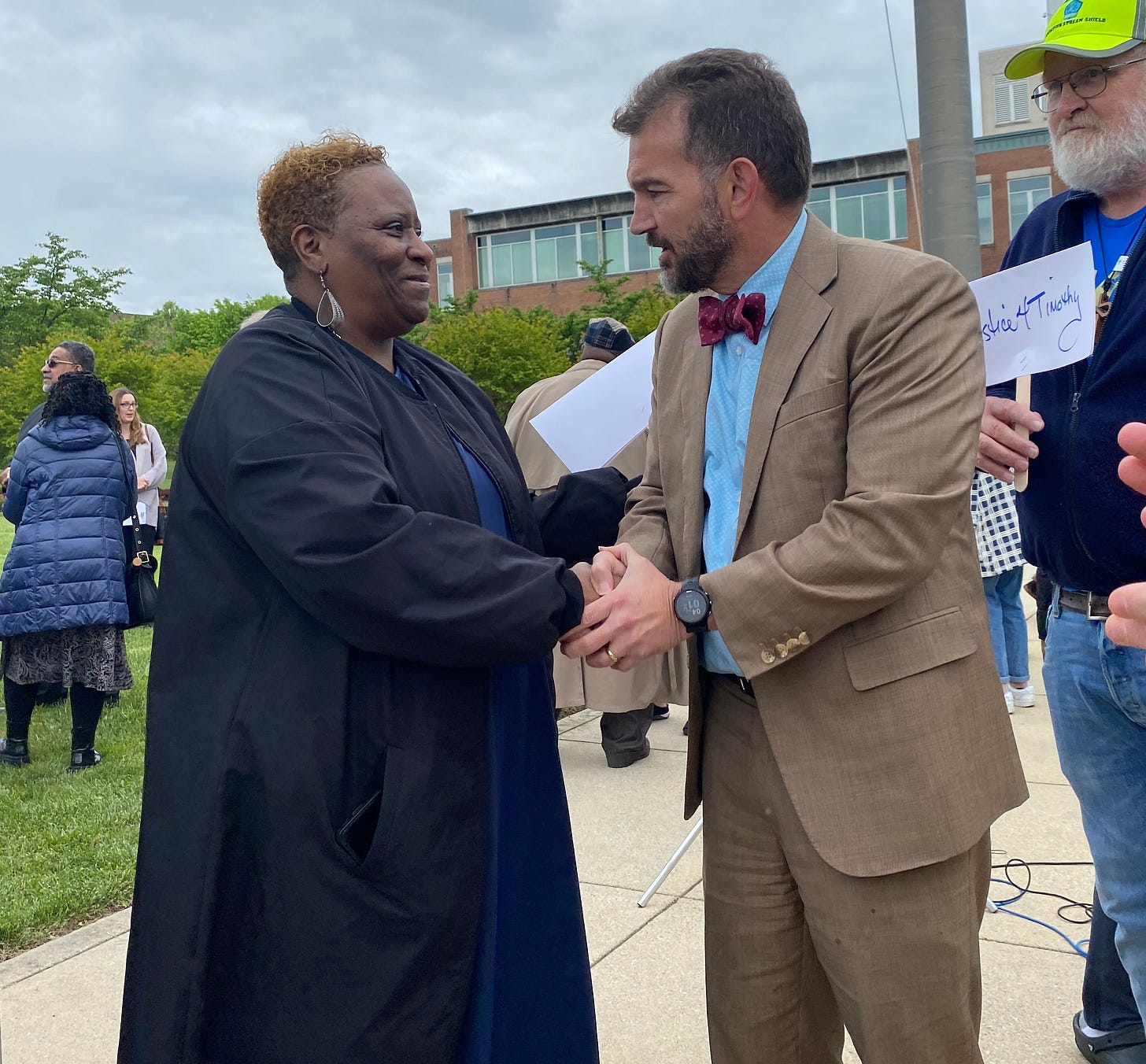 State Senator Chap Peterson greets Melissa Johnson, the mother of Timothy Johnson on May 2, 2023 in Fairfax