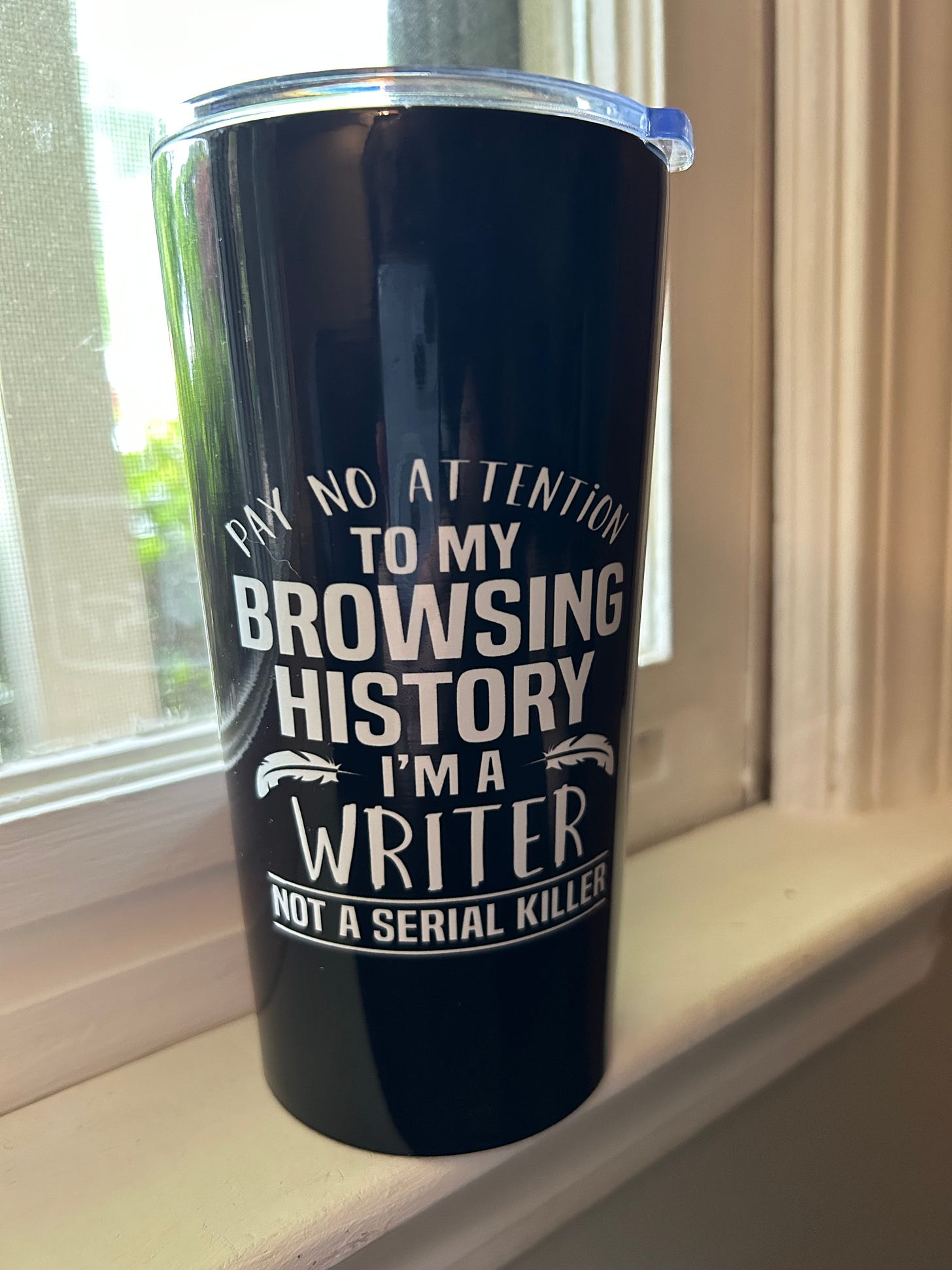 Black mug that reads "Pay no attention to my browsing history, I'm a writer not a serial killer" in white lettering