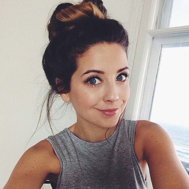 Zoella looks soooo good in this picture. She looks so fresh with her hair  in a messy bun, and simple makeup. | Zoella hair, Weave hairstyles, Zoella