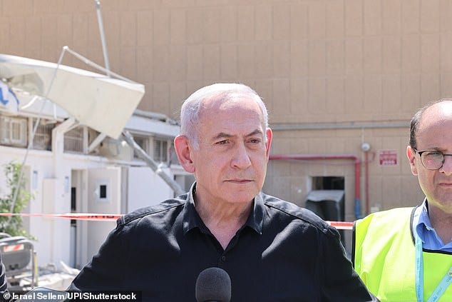 'Iran's terrorist tyrants launched missiles at Soroka Hospital and at a civilian population in the centre of the country,' he said. 'We will exact the full price from the tyrants in Tehran.' Pictured: Israeli Prime Minister Benjamin Netanyahu visits the Soroka hospital